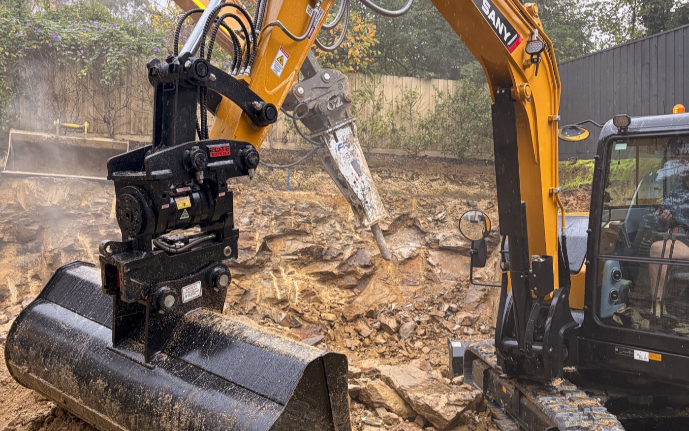 Hydraulic hammer on the rock as the cut went down