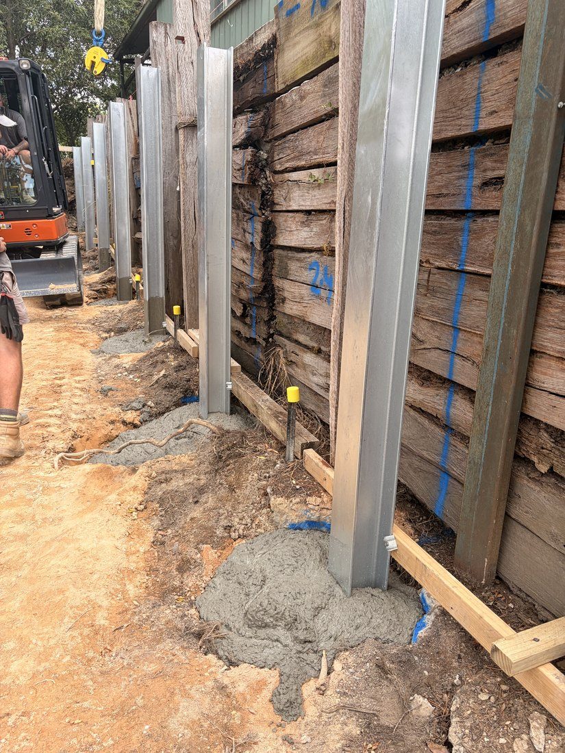 Galvanised posts concreted into the bored footings