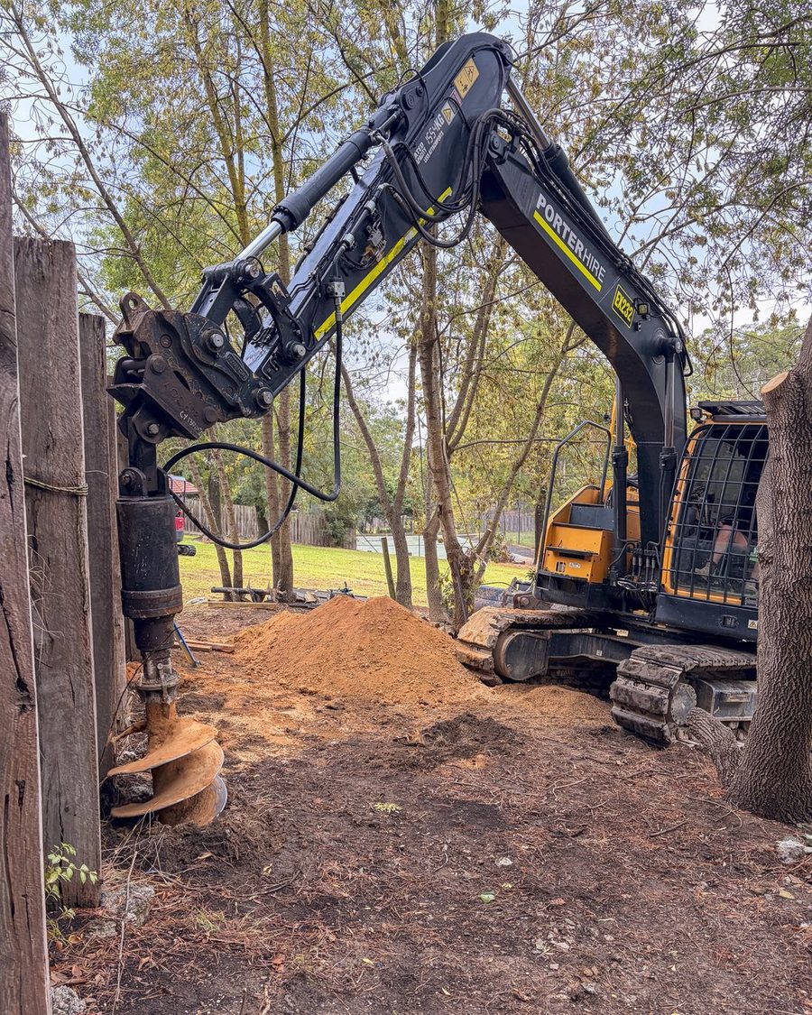 Deep footings drilled for the replacement retaining wall
