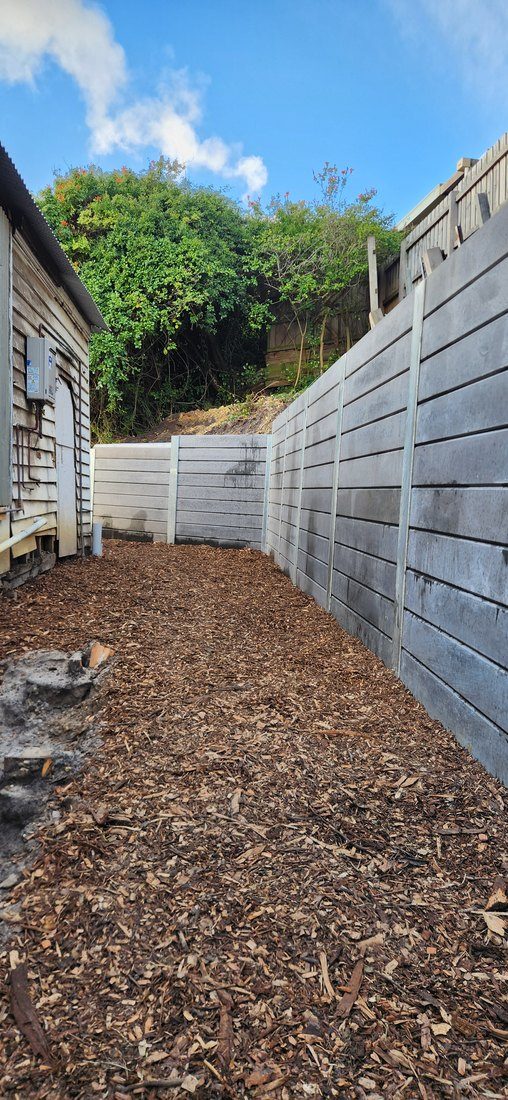 The completed wall and the level, drained area behind it