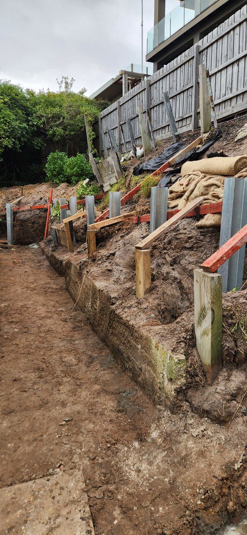 Galvanised steel posts set to line along the wall run